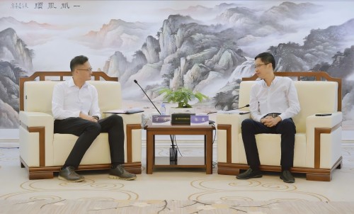 张翼会见上海市宝山区副区长丁力